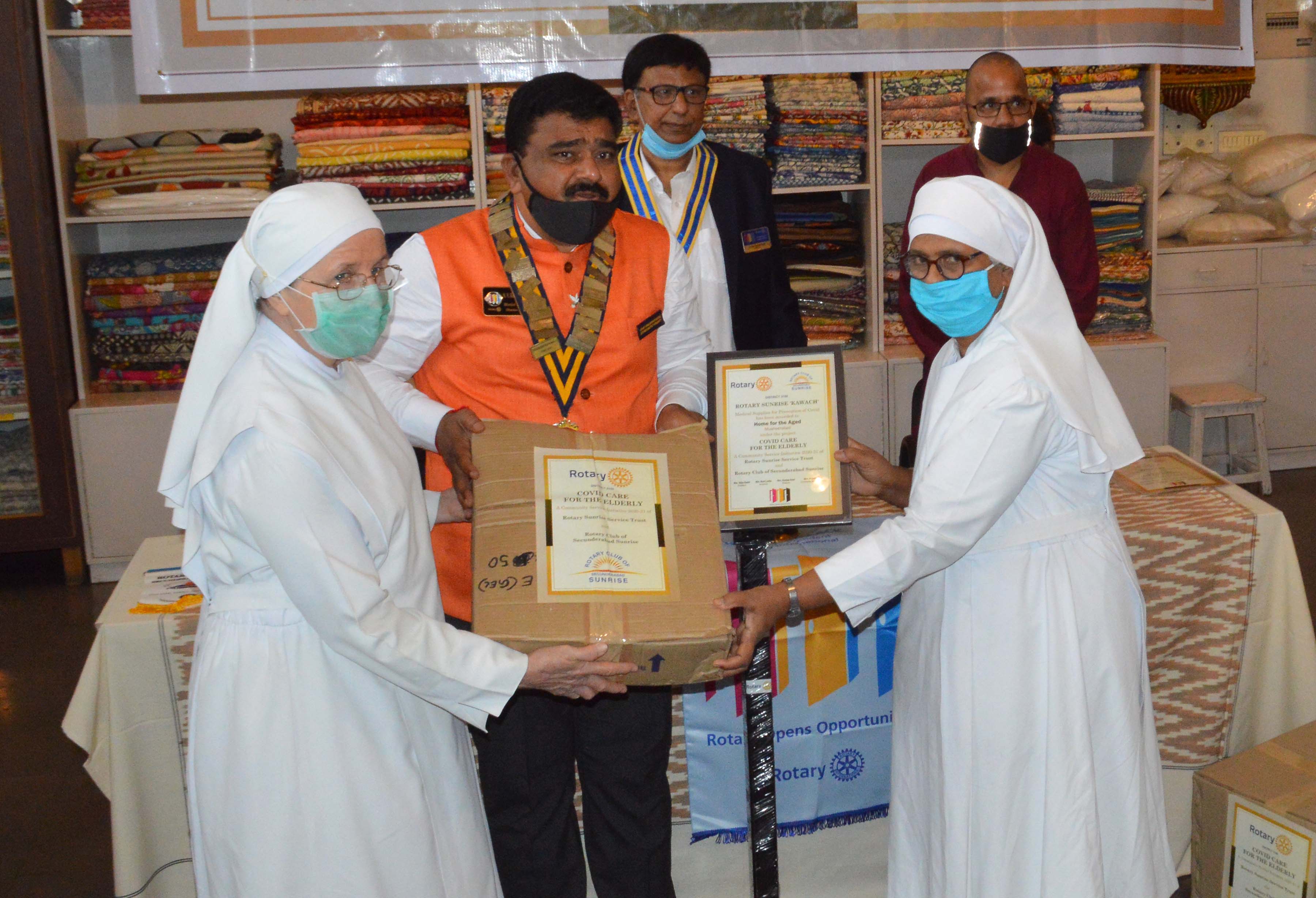 NV Hanmantha Reddy, Governor seen presnting Medical supplies to Sisters Kathleen and Josephine from Home for the Aged. Also seen is Vijay Rathi