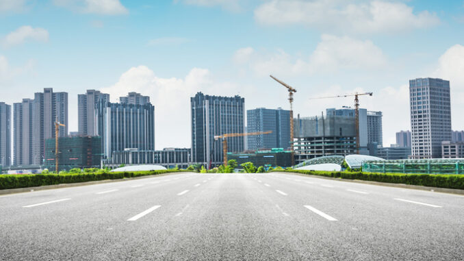 Asphalt road and modern city