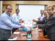 Dr. Anand Kumar, MD, Indian Immunologicals Ltd(Right) handing over the first batch of COVAXIN drug substance to Dr. Krishna Ella, CMD, Bharat Biotech(Left)