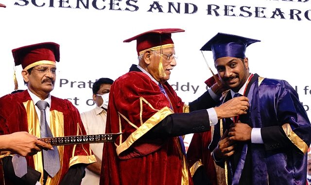 KNRUHS Vice-Chancellor, Prof. Karunakar Reddy, presents graduation certificates to MBBS students of Apollo Medical college