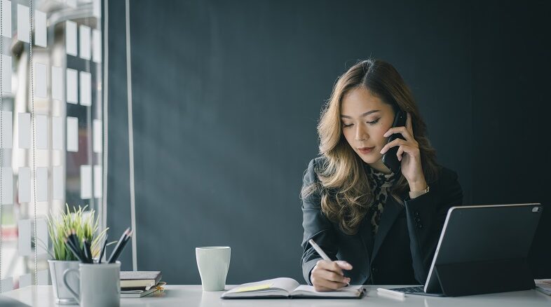 Portrait of beautiful smiling young entrepreneur businesswoman