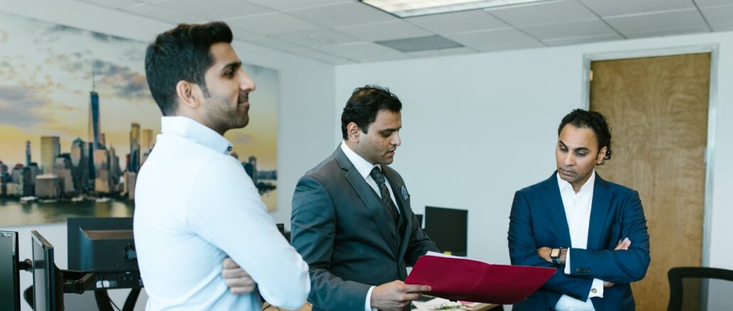 Photo by RODNAE Productions: https://www.pexels.com/photo/men-standing-in-the-middle-of-an-office-7580824/