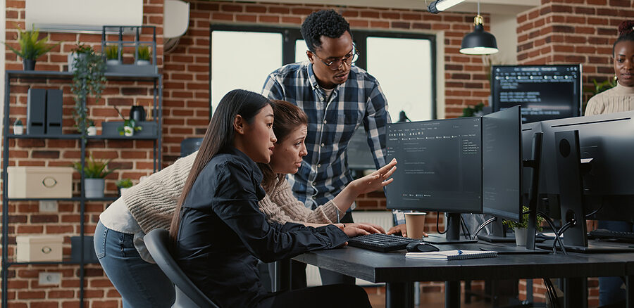 Mixed Team Of Software Engineers Brainstorming Ideas For New Clo