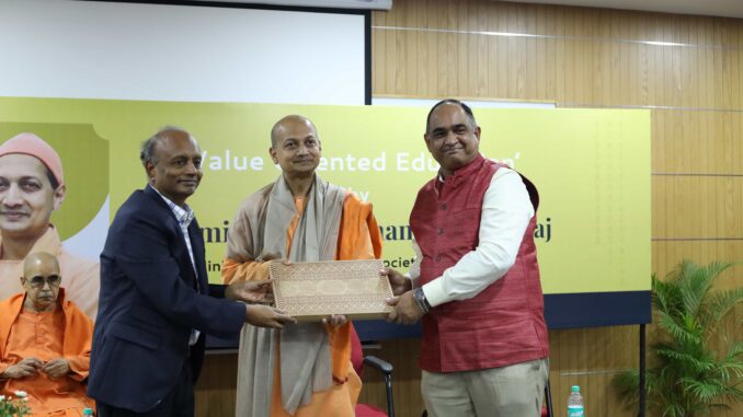 Prof (Dr) YSR Murthy, Vice Chancellor, RV University felicitating Swami Sarvapriyanandaji -Photo