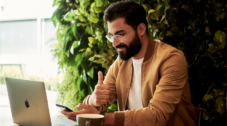 A business professional gives a thumbs-up after setting up an enterprise search platform.