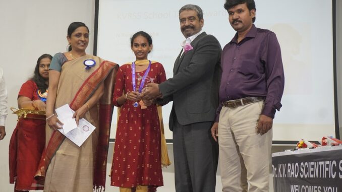 N Kusuma Latha ZPHS Eluru seen receiving KVRSS School Talent award for her science project from Dr Priya Abraham and Parto Prathimkar