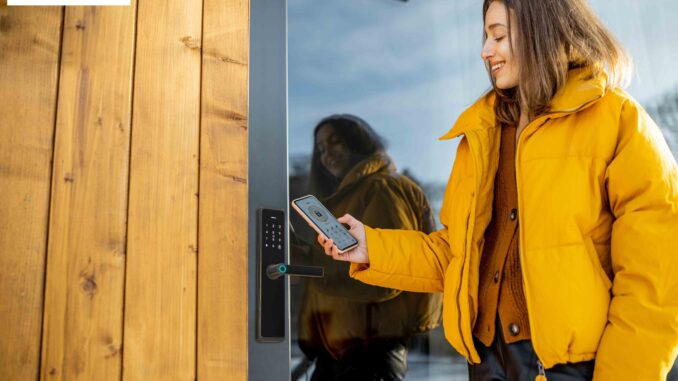 Woman,Locking,Smartlock,On,The,Entrance,Door,Using,A,Smart