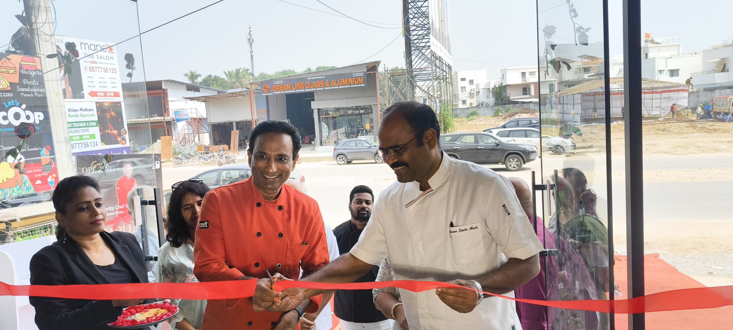 Celebrity Chefs Sanjay Thumma and Vikram Simha Akula performing the ribbon-cutting ceremony.