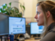 Businesswoman using online fax solutions at a desktop computer