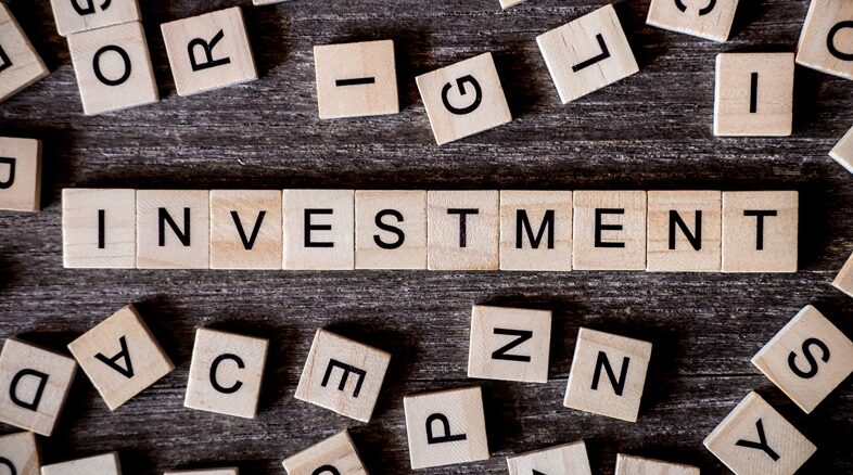 Concept presented by crossword with words investment with many w Best Investment options