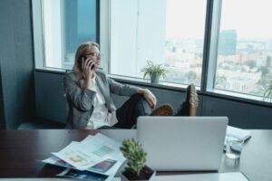 Photo by Tima Miroshnichenko: https://www.pexels.com/photo/a-woman-in-gray-coat-sitting-on-a-swivel-chair-while-having-a-phone-call-5717274/
